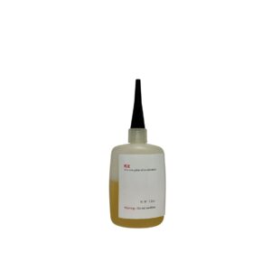 Yellow liquid in dispensing bottle