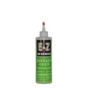 Glue bottle with red nozzle
