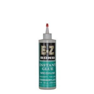 Glue bottle with red nozzle